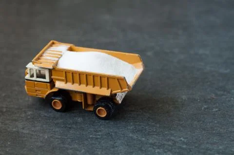 Model of big mining dump-body truck with white sugar Stock Photos