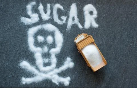 Model of big mining dump-body truck with skull of white sugar Stock Photos