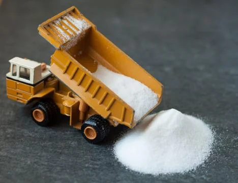 Model of big mining dump-body truck with white sugar Stock Photos