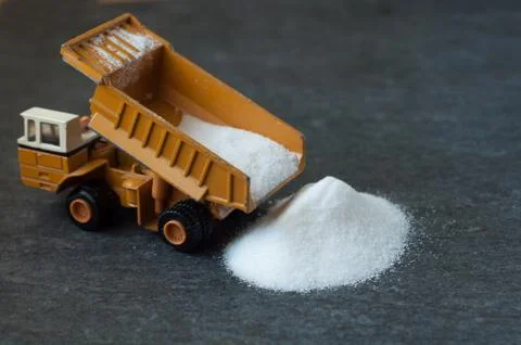 Model of big mining dump-body truck with white sugar Stock Photos