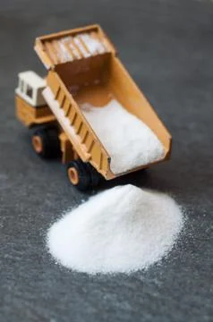 Model of big mining dump-body truck with white sugar 스톡 사진