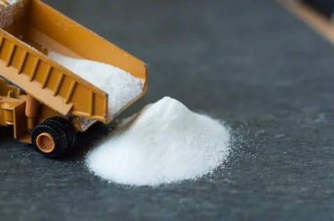 Model of big mining dump-body truck with white sugar Stock Photos