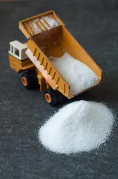 Model of big mining dump-body truck with white sugar Stock Photos