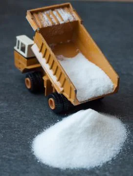 Model of big mining dump-body truck with white sugar Stock Photos