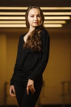 Model in black clothes elegant posing in frame Stock Photos