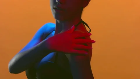 Model in blue red led strokes shoulder skin with palm Stock-Footage 340007597
