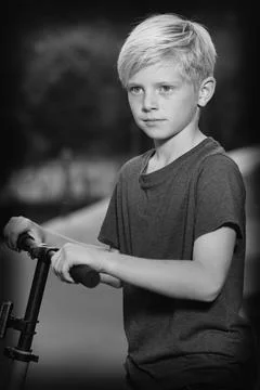 Model boy trying various poses for monochrome portrait photos in skate park Stock Photos