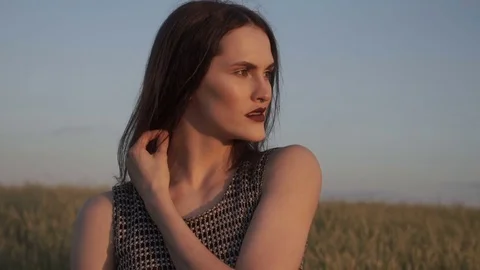 Model in bright light in field 库存影片 78886510