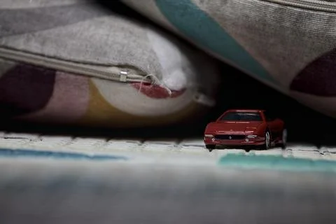 Model car next to pillows Stock Photos