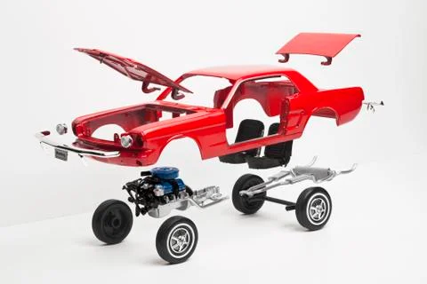 A model car taking a part, some pieces in mid-air Foto stock