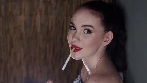 Model With Cigarette In the Studio Stock Footage 154094349