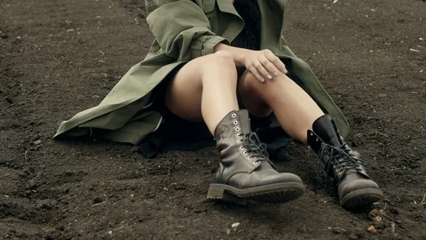 Model in coat posing on ground Stock Footage