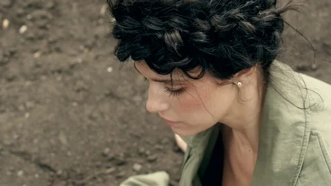 Model in coat posing on ground Stock Footage 76167453