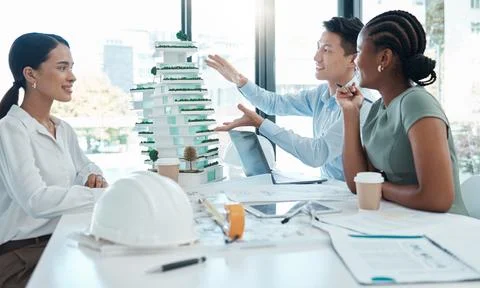 Model, construction and architects planning a building project together in an Stock Photos