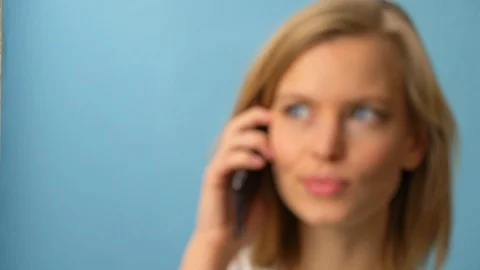 Model conversing over phone with gorgeous smile Stock Footage 103625893