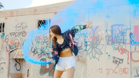 Model dancing with blue smoke slow motion Stock Footage 115952523