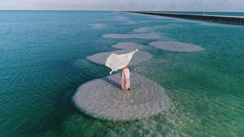 Model in the dead sea Stock Footage 135826011