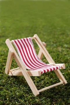 Model Deck Chair On Grass Stock Photos
