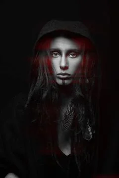 Model with dreadlocks hiding under hood studio portrait in RGB color split .. Stock Photos