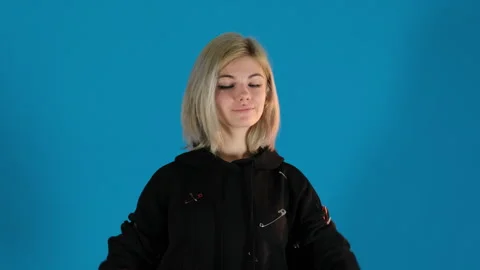 Model dressed in designed hoodie does warm-up with dumbbells Stock Footage 306501740