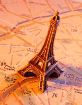 MODEL OF EIFFEL TOWER ON STREET MAP OF PARIS Stock Photos