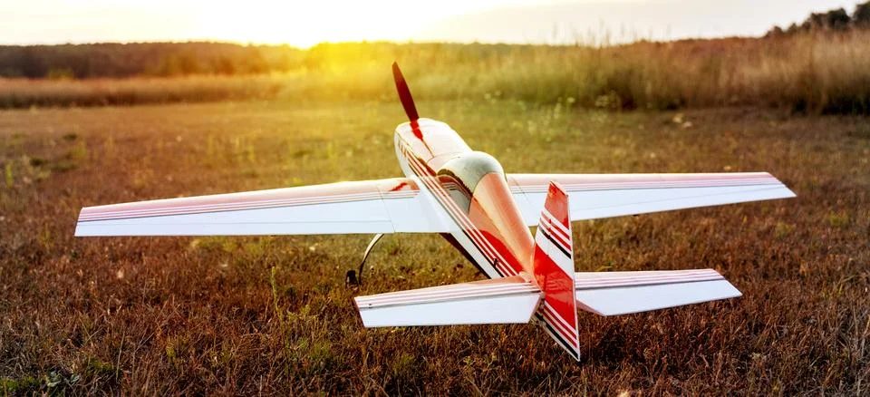 Model of an electrically controlled airplane at sunset 스톡 사진