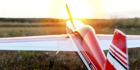 Model of an electrically controlled airplane at sunset Stock Photos
