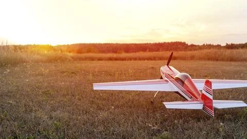 Model of an electrically controlled airplane at sunset 스톡 사진