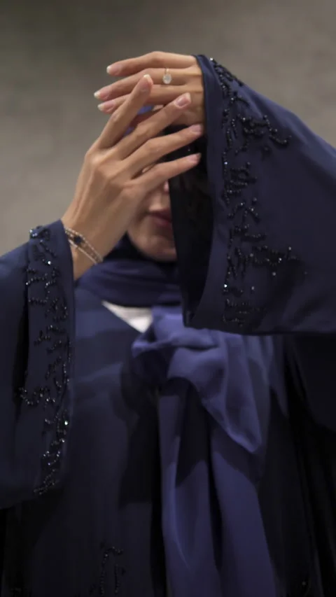 Model elegantly shows sleeves of Abaya encrusted with beads in tone Stock Footage 330189582