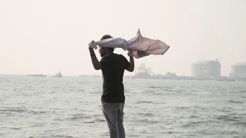 Model enjoying time looking into the sea 60fps youth young celebrating desperate Stock Footage 107810571