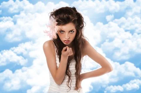 Model with feather accessory on white Stock Photos