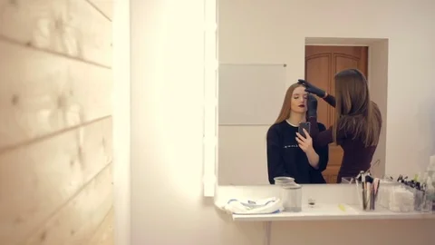 Model in the form of a nevety makes a selfie on the phone. A beautiful glamorous Video stock 81382020