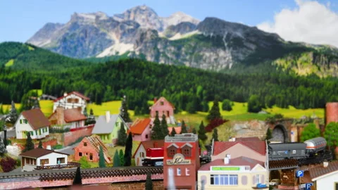 Model freight train moving on a mountain ambientation. Stock Footage 260808832