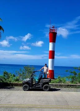 Model in front of a lighthouse Foto stock