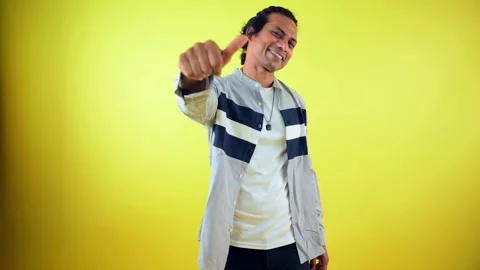 Model gestures playfully while posing during shoot Stock Footage 308617516