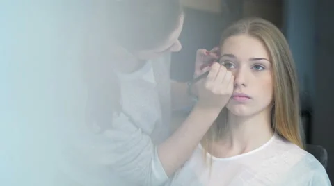 Model getting professional makeup Video stock 57239795