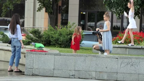 Model girl getting ready a, 2 more models awaiting the start of photography. Stock Footage 134466965