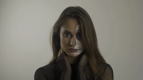 Model girl with professional make-up posing on camera. Halloween concept. 4k Stock Footage 118899353