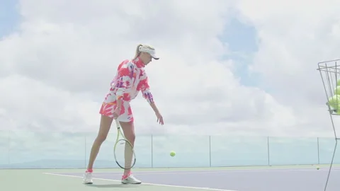 The model girl throws the ball through the net with a strong kick against the ba Stock Footage 154519283