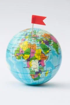 Model Globe With Red Flag Pin In Europe Stock Photos