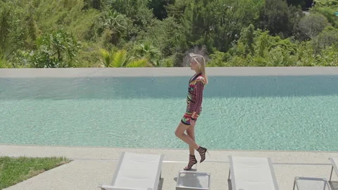 The model goes next to the pool on the general plan Stock Footage 154084857