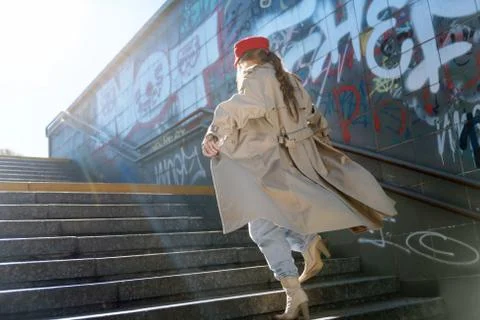 Model going upstairs while posing for street style magazine Stock Photos