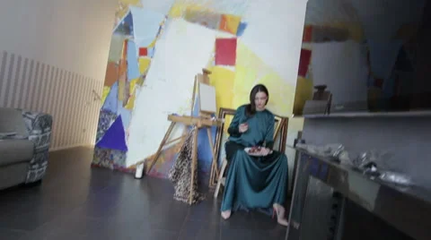 Model With Grapes Sitting In A Chair Stock Footage 52006422