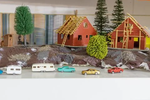 Model with a group of different small scale models of cars and caravans 스톡 사진