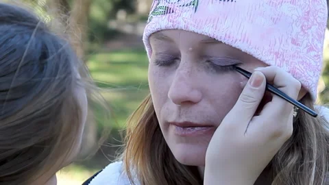 A model having eyeliner applied by a makeup artist Video stock 170036569