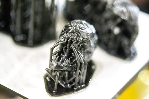 Model of head printed 3D printer from black rubber, close-up. Part of an object Stock Photos