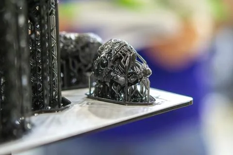 Model of head printed 3D printer from black rubber, close-up. Part of an object Stock Photos