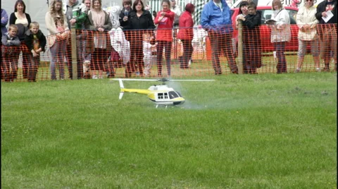 Model helicopter flying display to crowd at Bury country show Stock Footage 41682442