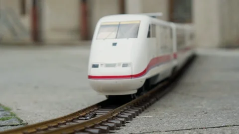 Model of high speed electric express train rides on model of railway on a city Vídeo Stock 115957905