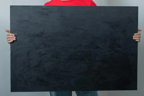 Model holding a black matte background Stock Photos